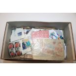 A box of various loose stamps