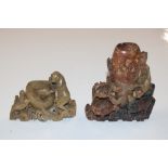 Two soapstone carved vases, decorated with monkeys