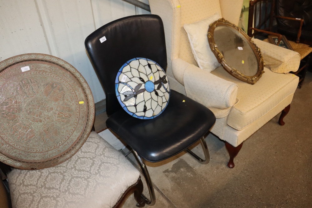 A retro type leatherette upholstered chair on stee