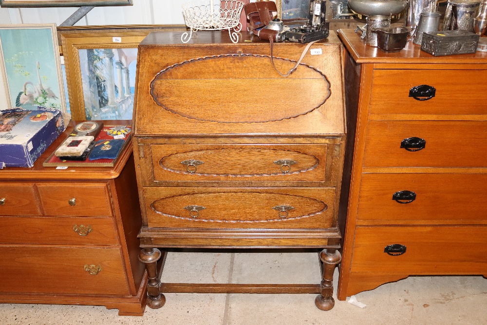 A 1930's oak two drawer bureau