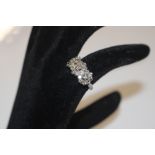 A white metal and diamond set cluster ring, ring s