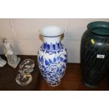 An Oriental blue and white baluster vase