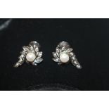 A pair of white metal diamond and pearl set ear ri