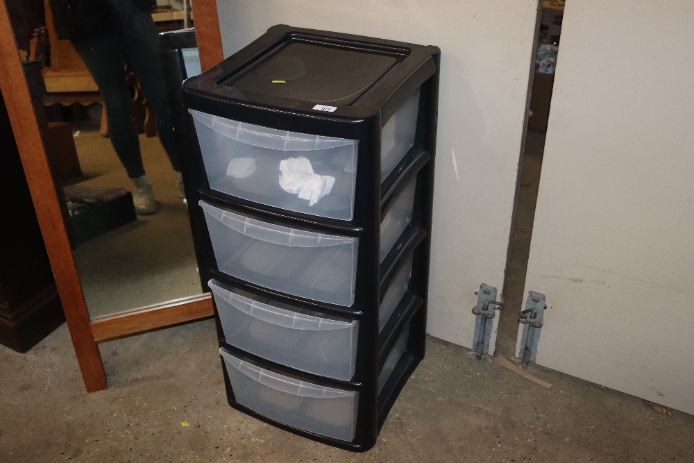 A plastic four drawer storage unit