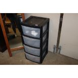 A plastic four drawer storage unit
