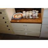 A laminate chest of three drawers