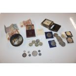 A box containing various coinage and bank notes, £