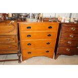 An Edwardian light oak chest of four drawers
