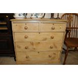 A Victorian stripped pine chest of two short and t