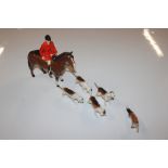 A Beswick fox hunting set including horse, huntsme