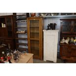 An oak glazed display cabinet