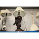 A figural table lamp in the form of a bear and sha