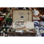 A vintage case and contents of various ephemera an