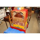 A wind up musical organ on stand