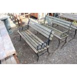 A wooden and metal two seater garden bench