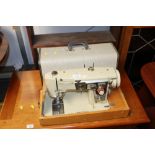 A Brother electric sewing machine in fitted case,