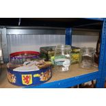 Three advertising tins and two glass storage jars