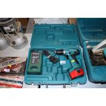 A Makita cordless drill with carry case and charger