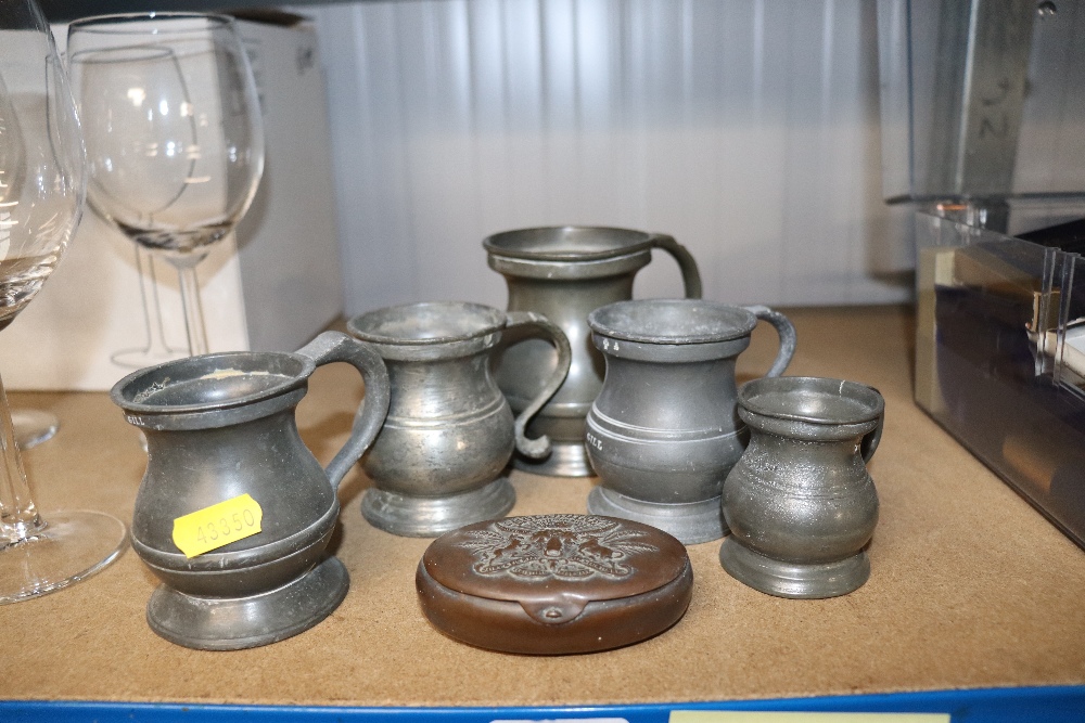 A quantity of pewter mugs and a small trinket box