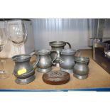 A quantity of pewter mugs and a small trinket box