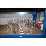 A quantity of various drinking glasses