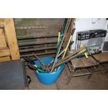 A tub of various gardening tools