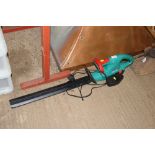 A Bosch cordless hedge trimmer with battery and ch