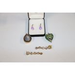 Two pairs of ear-rings; a green glass heart shaped