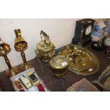 Two brass tea kettles on spirit heater stands