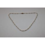 A natural pearl necklace with yellow metal clasp m