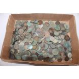 A tray of various old coins and metal detector fin