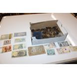 A box of various coinage and bank notes