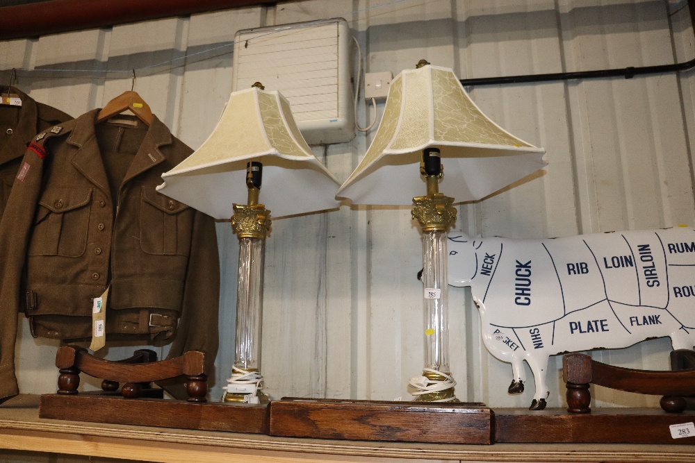 A pair of gilt metal mounted Corinthian column table lamps and shades