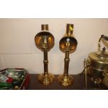 Two brass lace makers candlesticks