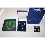 A box containing dolphin pendant, ear-rings and ot