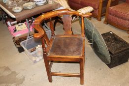 An antique elm corner chair