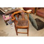 An antique elm corner chair