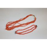 A multi strand coral necklace with gilt clasp; and