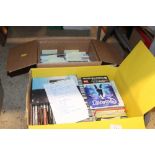 A box of miscellaneous CD's and DVD's