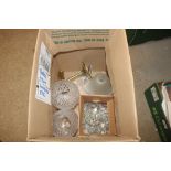 A box containing a quantity of glass lamp shades