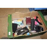 A box containing various purses, pictures etc.