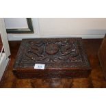 An Oriental carved wooden box decorate dragons and