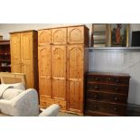 A pine three door wardrobe fitted drawer below and