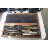 A mahogany case and contents of drawing instrument