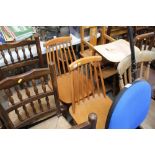 Two Ercol style stick back chairs