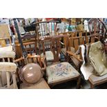 A stick back elbow chair with tapestry seat and a