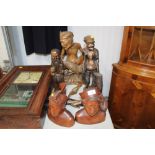 A collection of carved wooden ornaments and busts