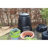 A black wall compost bin