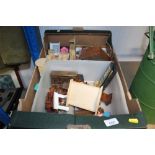 A box containing various dolls house furniture to