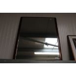 A framed wall mirror